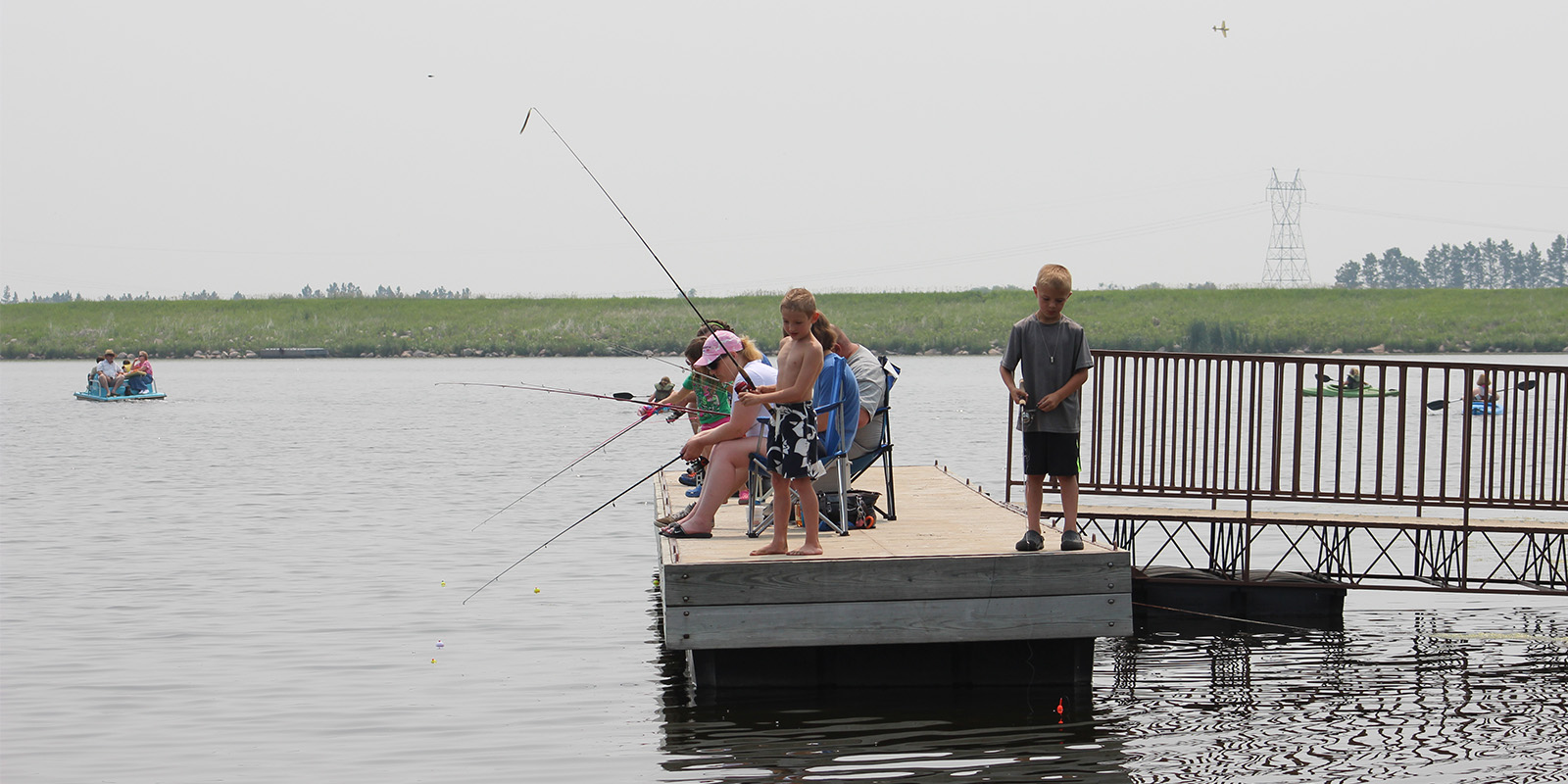 Kids fishing on Dock at McDowell Dam